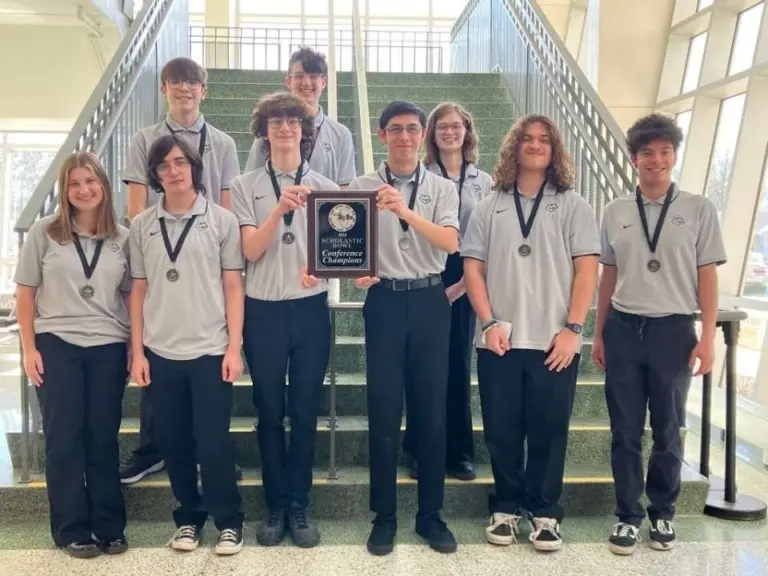 Galesburg High School students holding Scholastic Bowl championship award