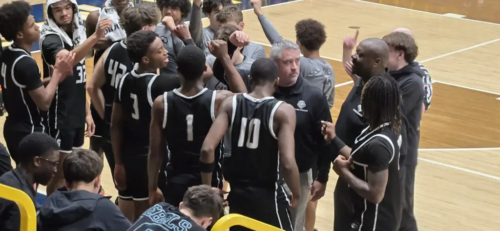 GHS boys basketball team huddle during game at Sterling. February 2026