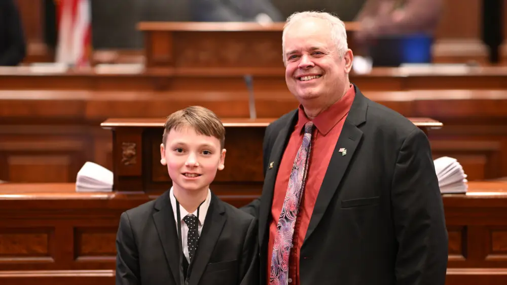 Colum Morgan and State Rep. Dan Swanson on the floor of the Illinois House of Representatives