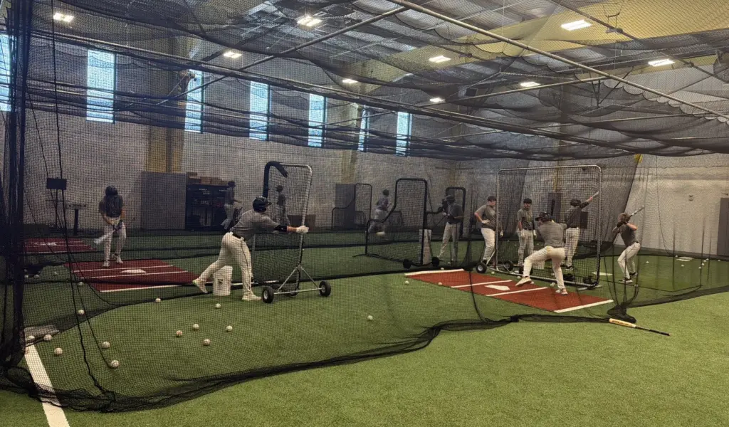 Galesburg High School Silver Streaks baseball players during indoor batting practice on the turf facility, 2026