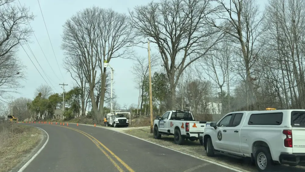 Tree removal crews along South Lake Storey Road in Galesburg, Illinois, March 24, 2026, as construction begins on the Lake Storey multi-use walking path
