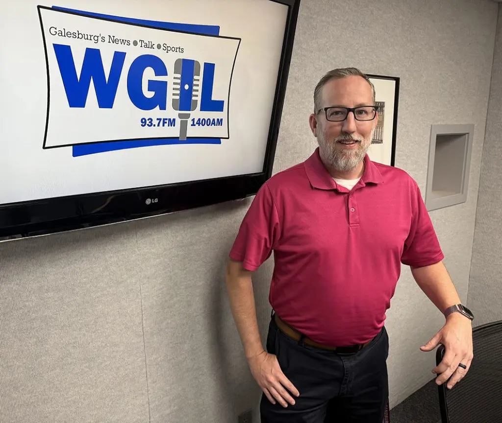 Alt: Knox County Board Chairman Jared Hawkinson standing in the WGIL studio