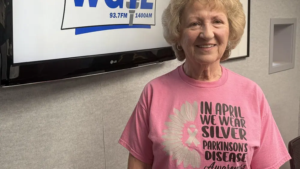 Marcia Parrish wearing a Parkinson's Disease Awareness shirt at the WGIL studio