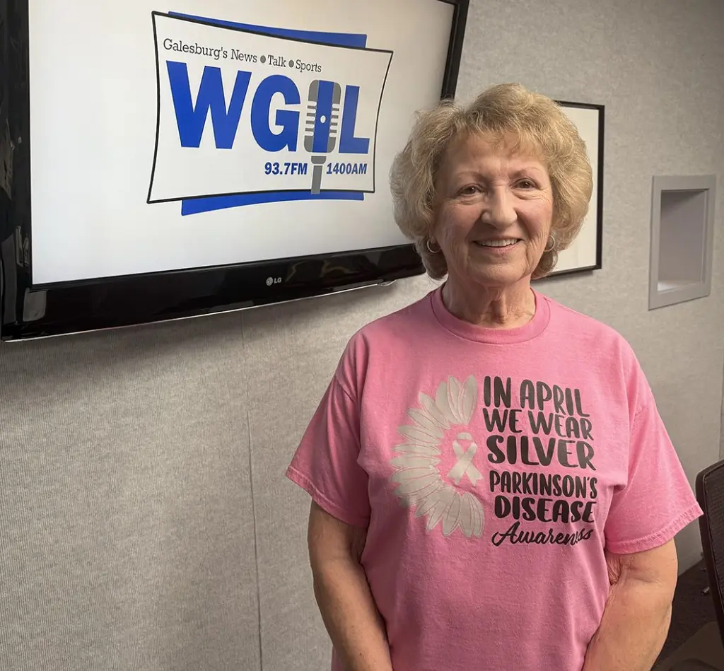 Marcia Parrish wearing a Parkinson's Disease Awareness shirt at the WGIL studio