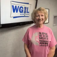 Marcia Parrish wearing a Parkinson's Disease Awareness shirt at the WGIL studio