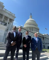 The KCAP Washington delegation — C. Andrew McGadney, Aaron Gavin, Adam Vitale, and Ken Springer — outside the U.S. Capitol in April 2026.