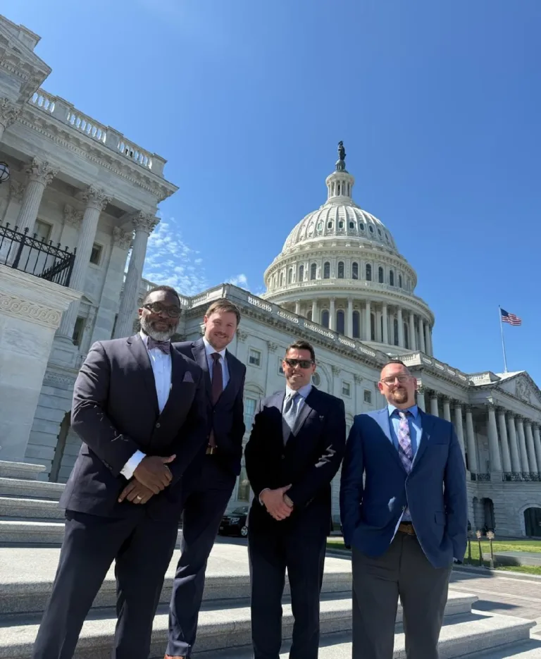 The KCAP Washington delegation — C. Andrew McGadney, Aaron Gavin, Adam Vitale, and Ken Springer — outside the U.S. Capitol in April 2026.