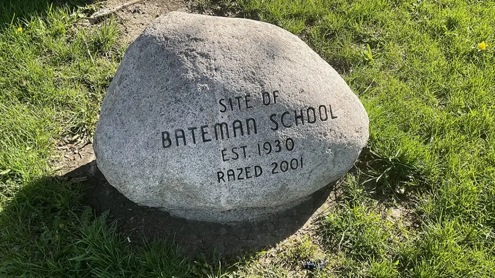 A stone marker at the former site of Bateman School in Galesburg, Illinois, reading "Site of Bateman School, Est. 1930, Razed 2001."