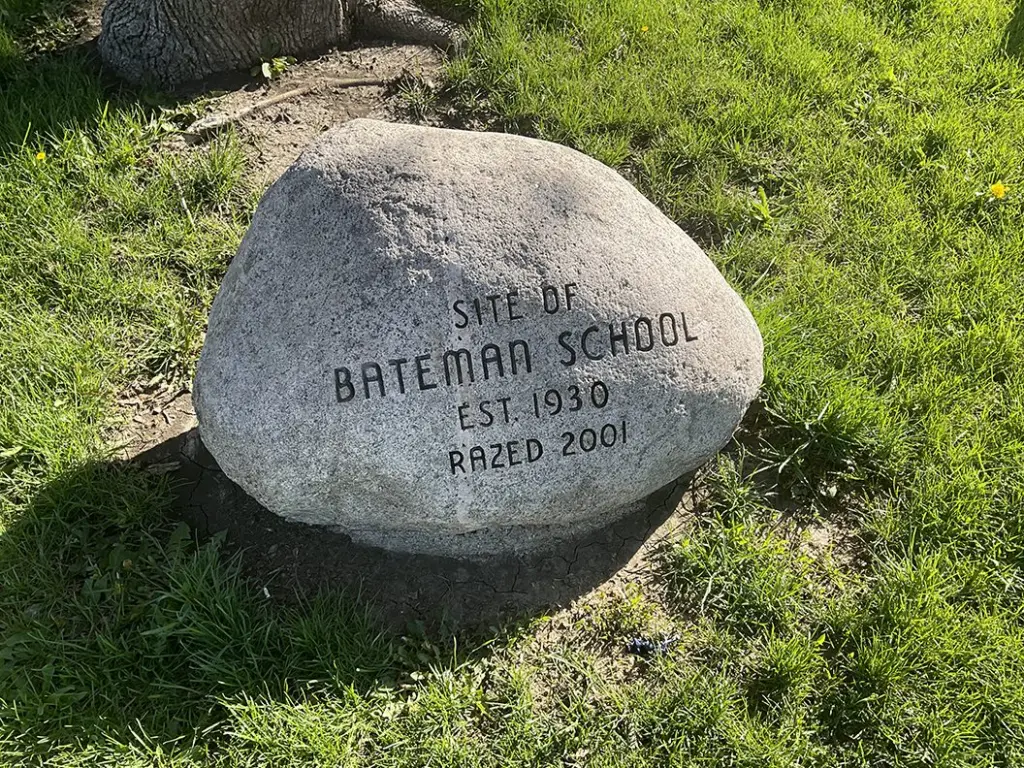 A stone marker at the former site of Bateman School in Galesburg, Illinois, reading "Site of Bateman School, Est. 1930, Razed 2001."