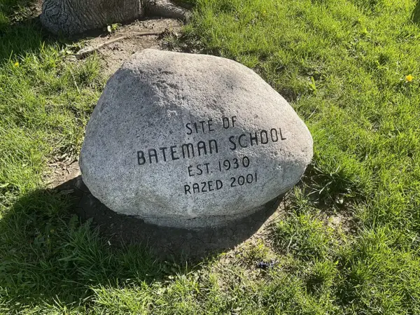 A stone marker at the former site of Bateman School in Galesburg, Illinois, reading "Site of Bateman School, Est. 1930, Razed 2001."