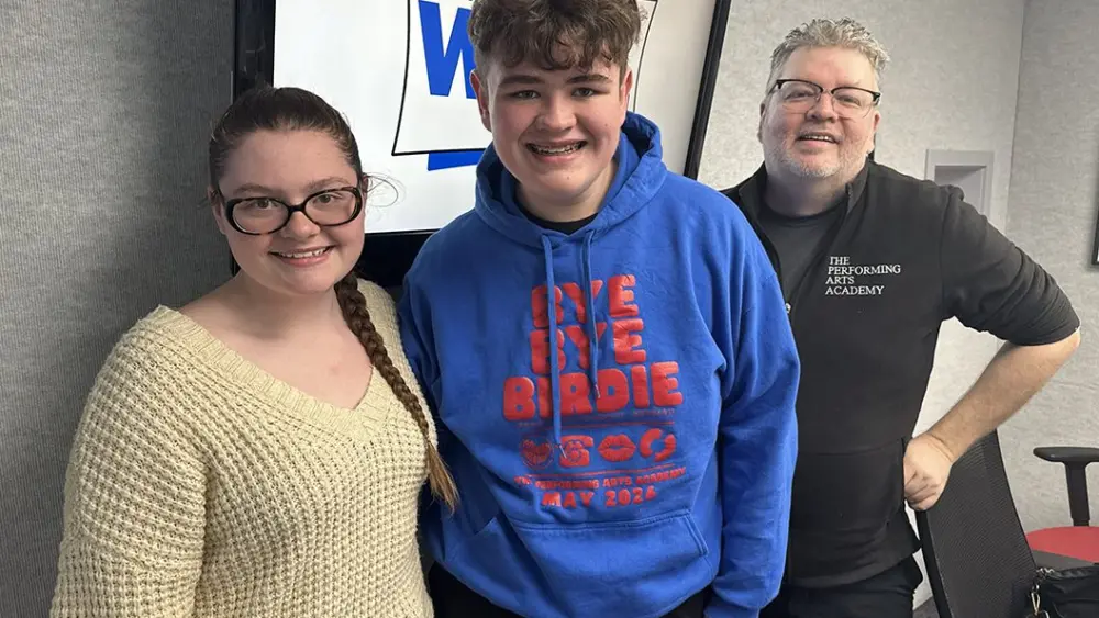 Performing Arts Academy director Tim Holmes and cast members Mallory Fineran and Dean McNally at WGIL in Galesburg, Illinois, April 28, 2026.