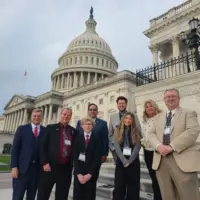 Illinois county clerk delegation poses outside the U.S. Capitol in Washington, D.C., on April 28, 2026