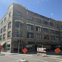 Road closed signs in front of the Weinberg Arcade building at South Prairie and East Simmons streets in downtown Galesburg, Illinois