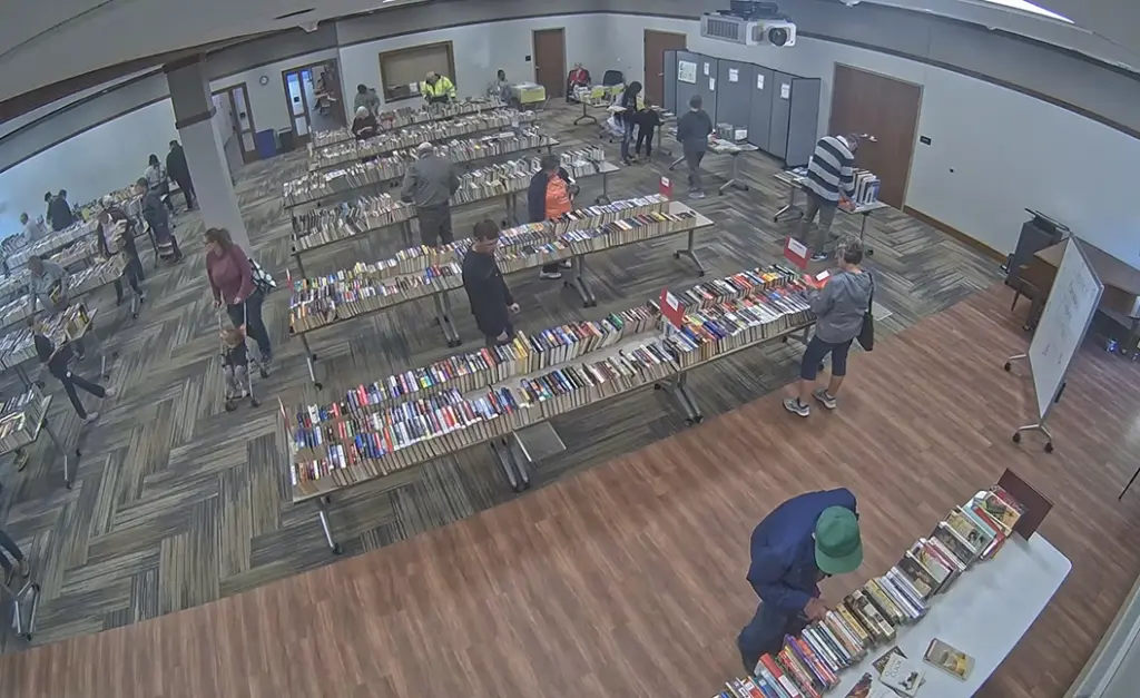 Shoppers browse rows of books at the Friends of the Galesburg Public Library annual book sale in the Galesburg Public Library Community Room