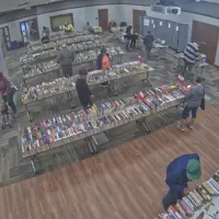 Shoppers browse rows of books at the Friends of the Galesburg Public Library annual book sale in the Galesburg Public Library Community Room