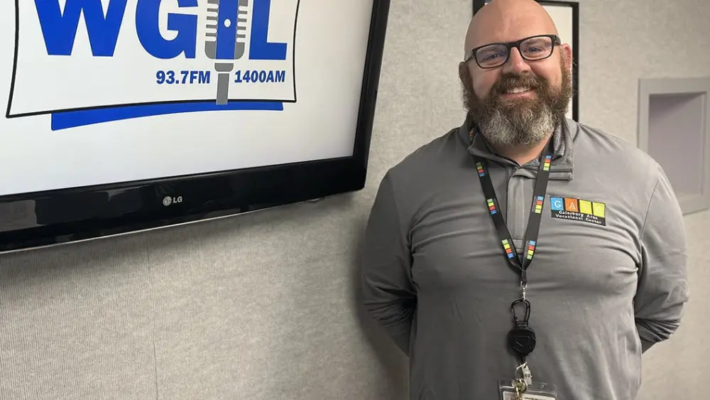Adam Seaney, director of the Galesburg Area Vocational Center, poses in the WGIL studios in Galesburg, Illinois