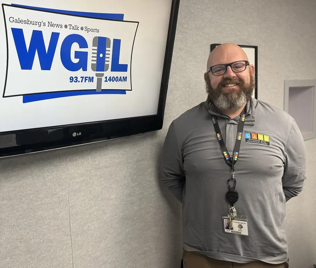 Adam Seaney, director of the Galesburg Area Vocational Center, poses in the WGIL studios in Galesburg, Illinois