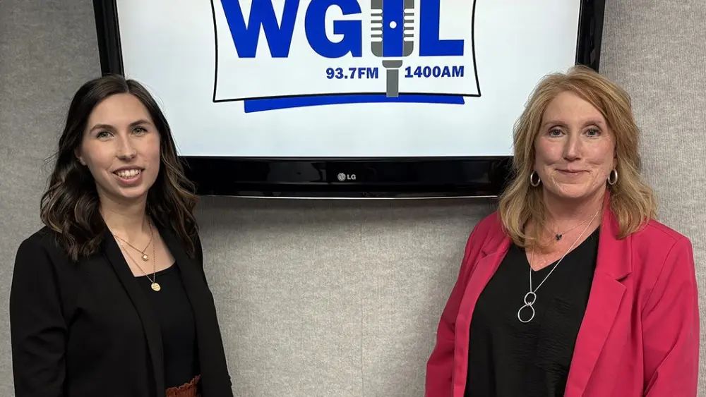 Jennie Grove and Alesia Shaw of the Canton History & Arts Alliance pose in the WGIL studios in Galesburg, Illinois