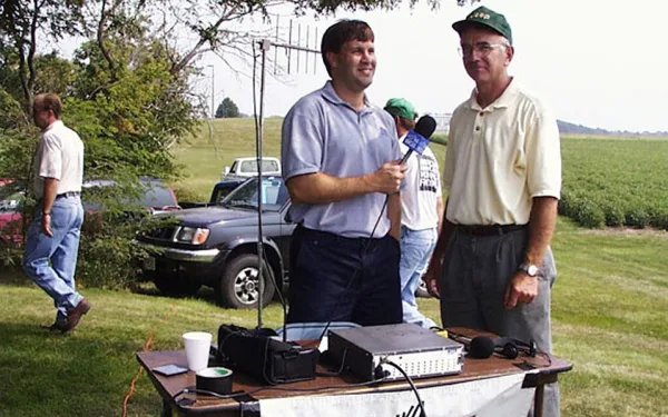 Ted Mottaz and WGIL farm director Jim Lee at an outdoor ag event, 2002