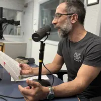 Nicholas Regiacorte reading from Kaveh Akbar's novel Martyr at the WGIL studios, May 19, 2026