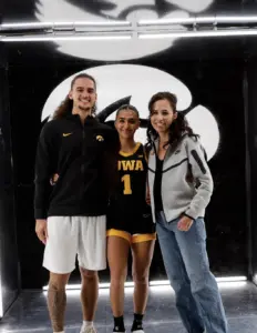 Bria Medina with fiancé Joshua Stewart and her mother during her official visit to the University of Iowa, May 12, 2026. 