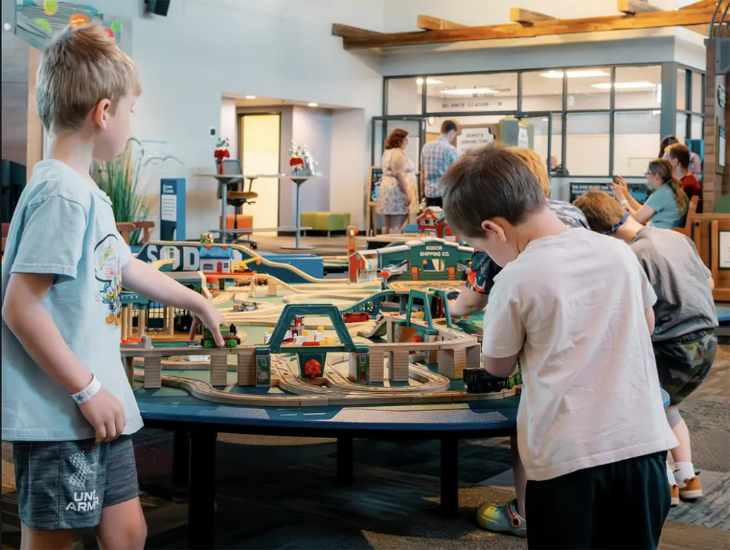 Children playing at the train table inside Discovery Depot Children's Museum in Galesburg, Illinois