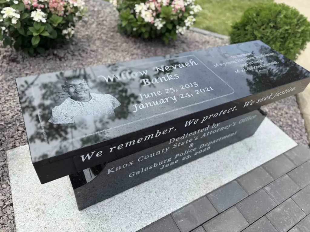 Close-up of the Willow Nevaeh Banks memorial bench inscription at Kiwanis Park in Galesburg — June 25, 2026