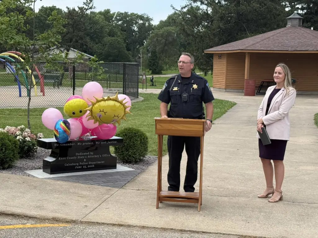 Galesburg Police Chief Kevin Legate and Knox County State's Attorney Ashley Worby at the Willow Banks memorial bench dedication at Kiwanis Park — June 25, 2026