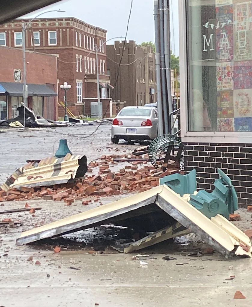 Brick and building debris scattered across a downtown Monmouth street after the June 17 tornado