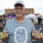 2026 Taste of Galesburg: An attendee shows off his haul at the 40th Taste of Galesburg, Thursday, July 16, 2026. (Photo courtesy STEVE DAVIS/SeedCo Media)

