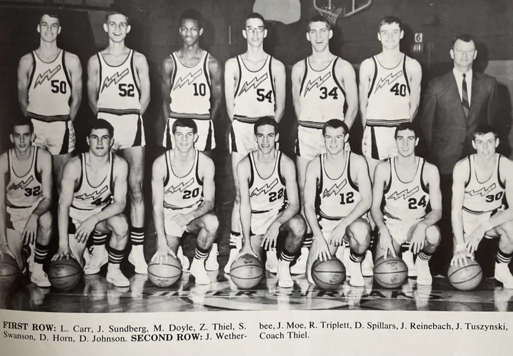 Team photo of the 1968-69 Galesburg Silver Streaks basketball team, with Coach John Thiel standing at right.