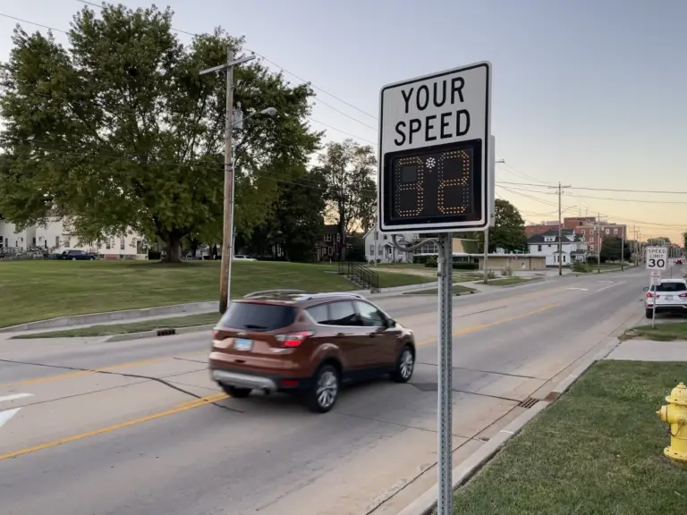 A speed feedback sign showing a vehicle's speed above a posted 30 mph speed limit sign in Galesburg