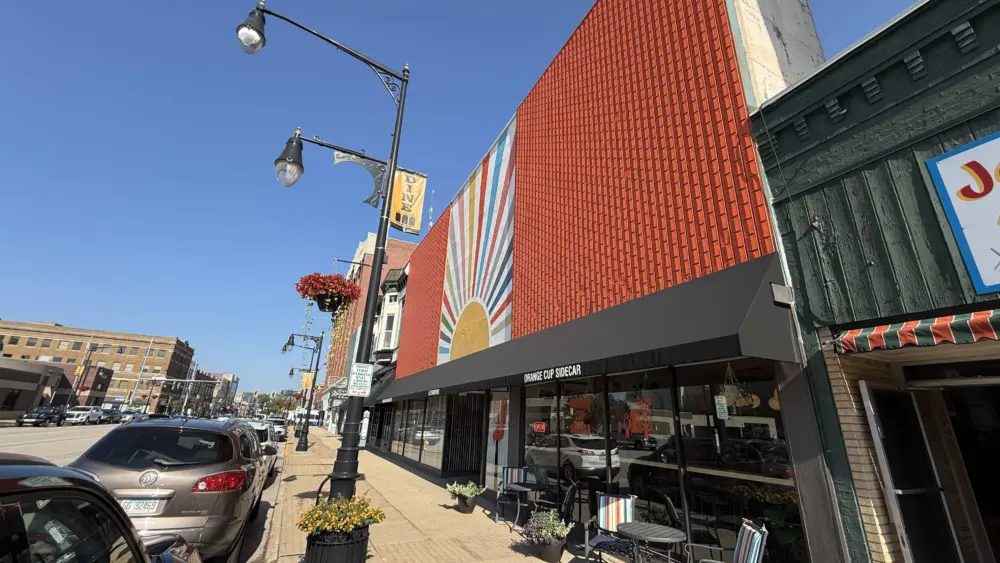 The colorful and orange facade of the Orange Cup Sidecar building in downtown Galesburg