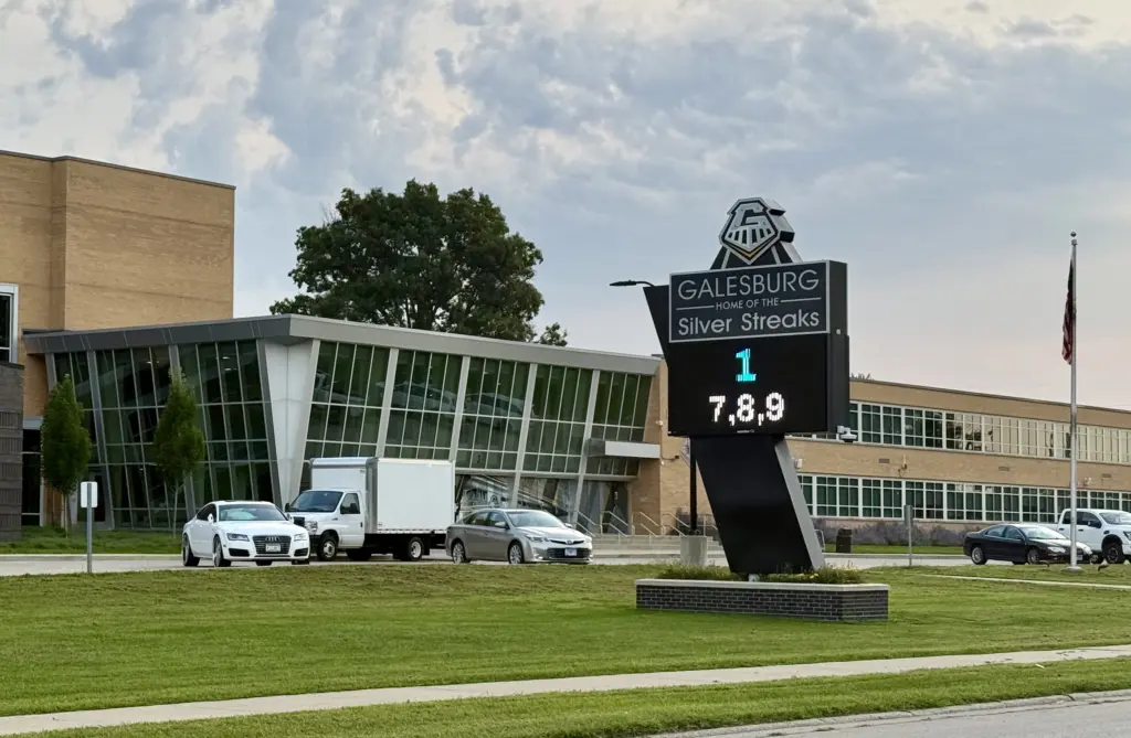 Galesburg High School sign reading "Galesburg, Home of the Silver Streaks" with a digital countdown display