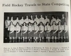 Black and white team photo of the Galesburg High School field hockey team holding sticks, from a 1970s GHS yearbook page titled "Field Hockey Travels to State Competition"