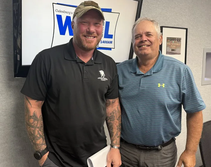 Chuck Newton and Dan Swanson standing together in the WGIL studio