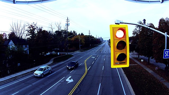 This shot of a red light was taken with a hovering DJI Phantom Drone, this is a Western (due South) shot of Plains Rd in Burlington, Ontario. Dave Lauretti from Burlington, Canada Creative Commons Attribution 2.0