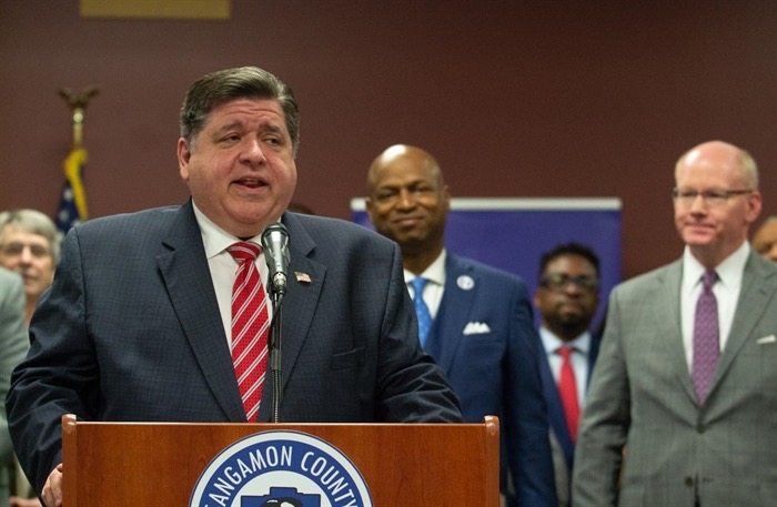 Gov. JB Pritzker speaks at a news conference Thursday alongside House Speaker Emanuel "Chris" Welch and Senate President Don Harmon. The three Democratic leaders are in the midst of budget negotiations with just over a week remaining on the legislative schedule for the spring session. (Capitol News Illinois photo by Jerry Nowicki) 