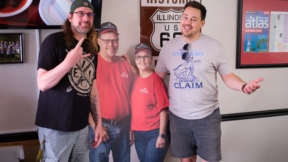 Ryan and Rocki with cardboard cutouts of the owners of The Chili Parlour of Springfield (Credit: Trent R Nelson)