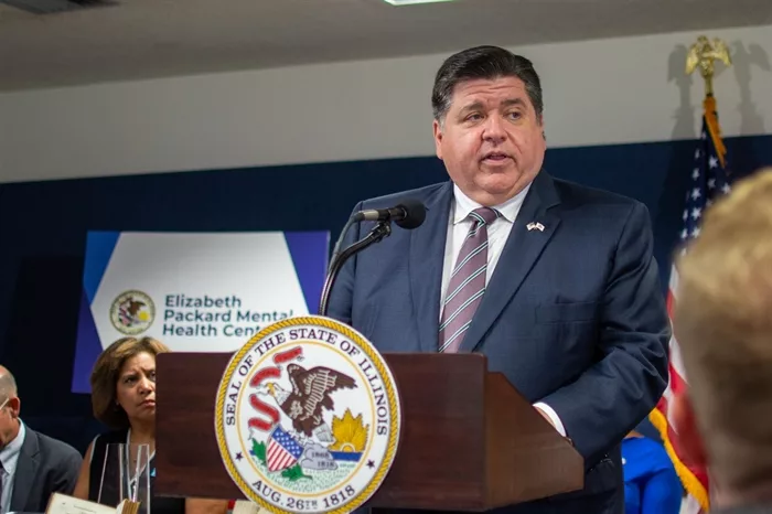 Gov. JB Pritzker speaks at a news conference in Springfield on Wednesday before signing an order to rename McFarland Mental Health Center after Elizabeth Packard, a woman who was committed into an Illinois asylum against her will in 1860.