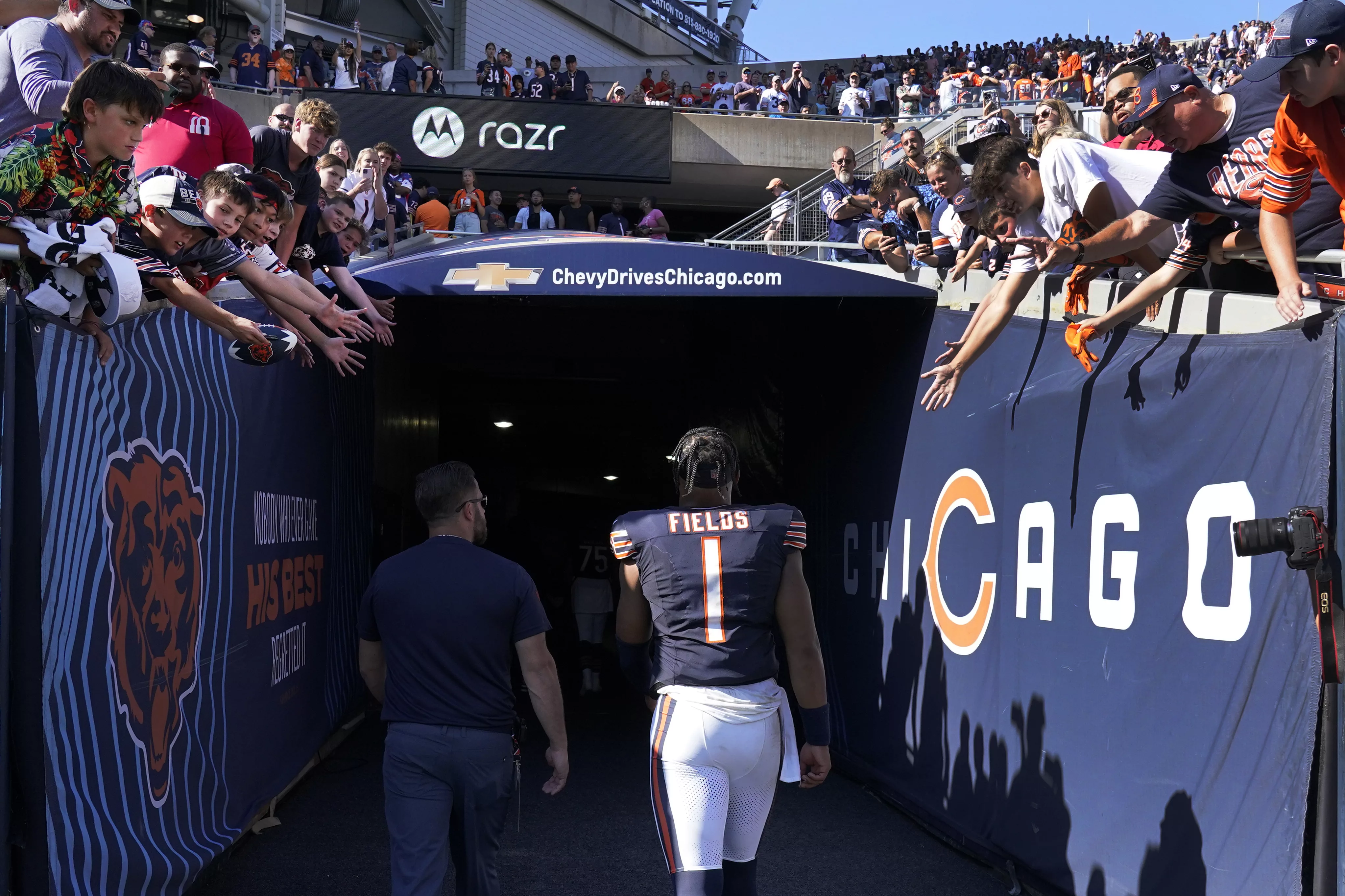 Chicago Bears quarterback Justin Fields walks off the field after the team's 31-28 loss to the Denver Broncos in an NFL football game Sunday, Oct. 1, 2023, in Chicago. (AP Photo/Nam Y. Huh)
