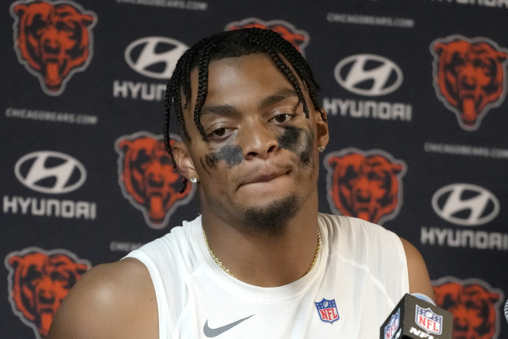 Chicago Bears quarterback Justin Fields listens to a reporter's question after his team's 31-28 loss to the Denver Broncos after an NFL football game Sunday, Oct. 1, 2023, in Chicago. (AP Photo/Nam Y. Huh)