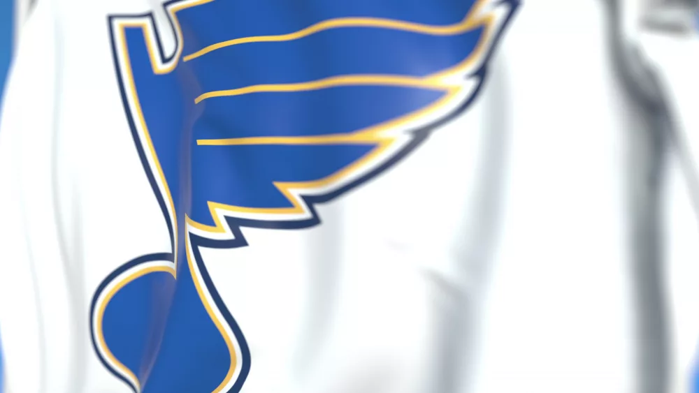 Waving flag with St. Louis Blues NHL hockey team logo. Editorial 3D