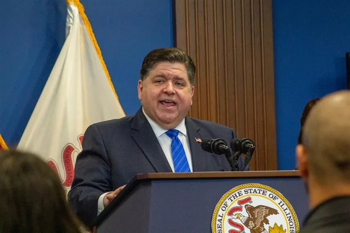Gov. JB Pritzker responds to questions during a Nov. 16 news conference announcing $160 million in state aid to Chicago and other municipalities to assist in housing asylum seekers. (Capitol News Illinois photo by Dilpreet Raju)
