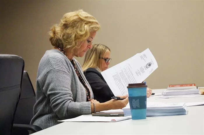 Illinois State Board of Elections members Cristina Cray, left, and Tonya Genovese listen as the board considers a challenge to former President Donald Trump’s qualifications to appear on the March 19 Republican primary ballot. The board voted 8-0 to leave his name on the ballot. (Capitol News Illinois photo by Peter Hancock)