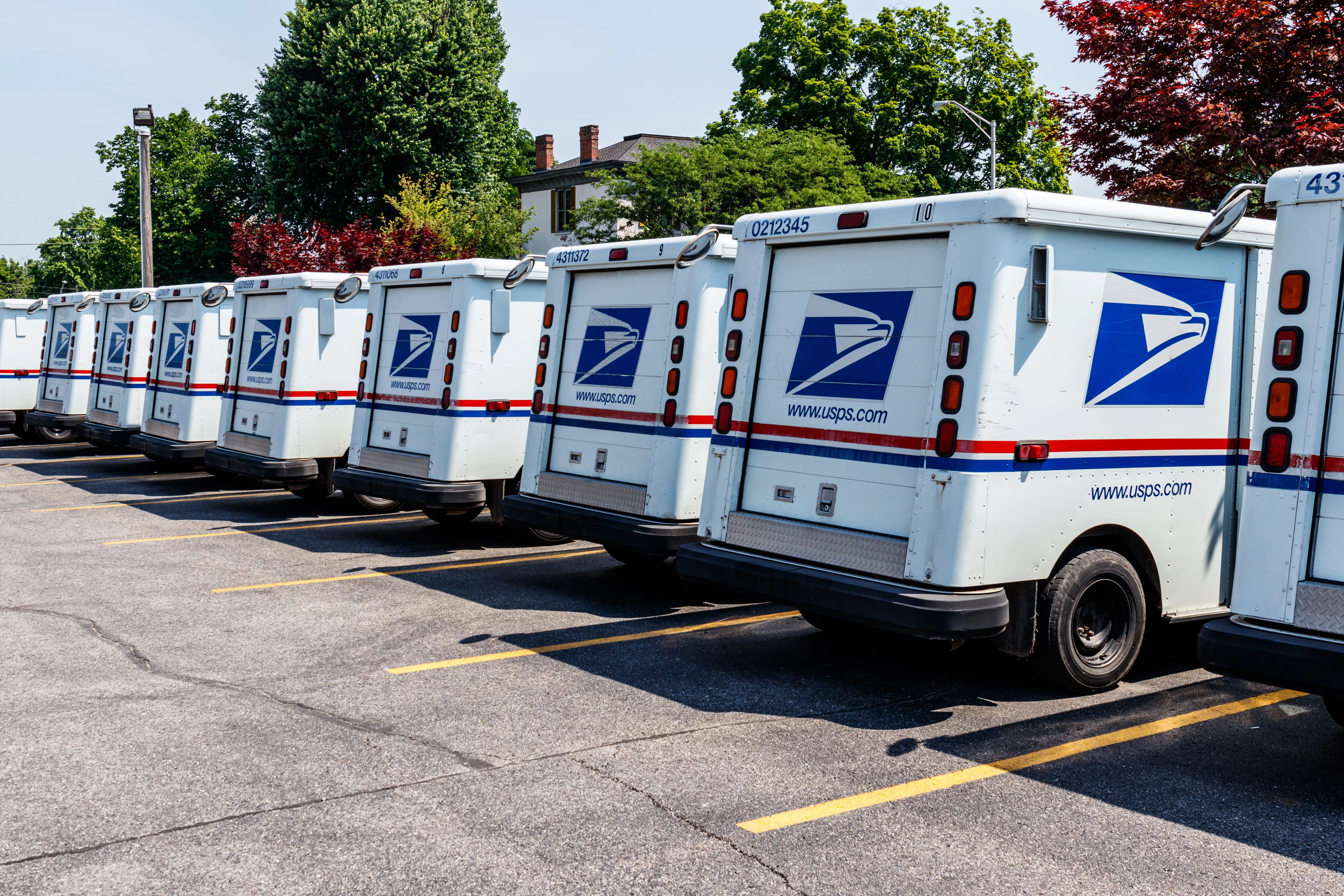 Logansport - Circa June 2018: USPS Post Office Mail Trucks. The Post Office is Responsible for Providing Mail Delivery IV