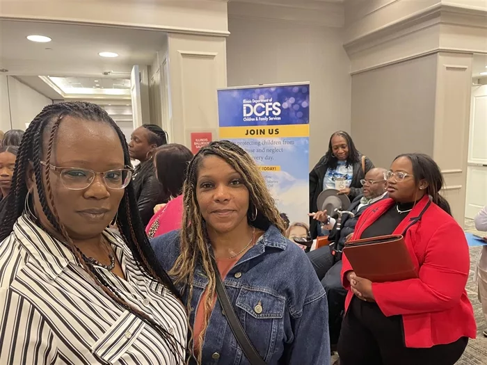Tina Clayborne and Cyrenthia Threat stand in line to process their applications at the Illinois Department of Children and Family Services’ On-The-Spot Hiring event on Wednesday at the Fountains Conference Center in Fairview Heights. DCFS Officials said 303 people attended with 123 receiving conditional job offers. (Capitol News Illinois photo by Beth Hundsdorfer)