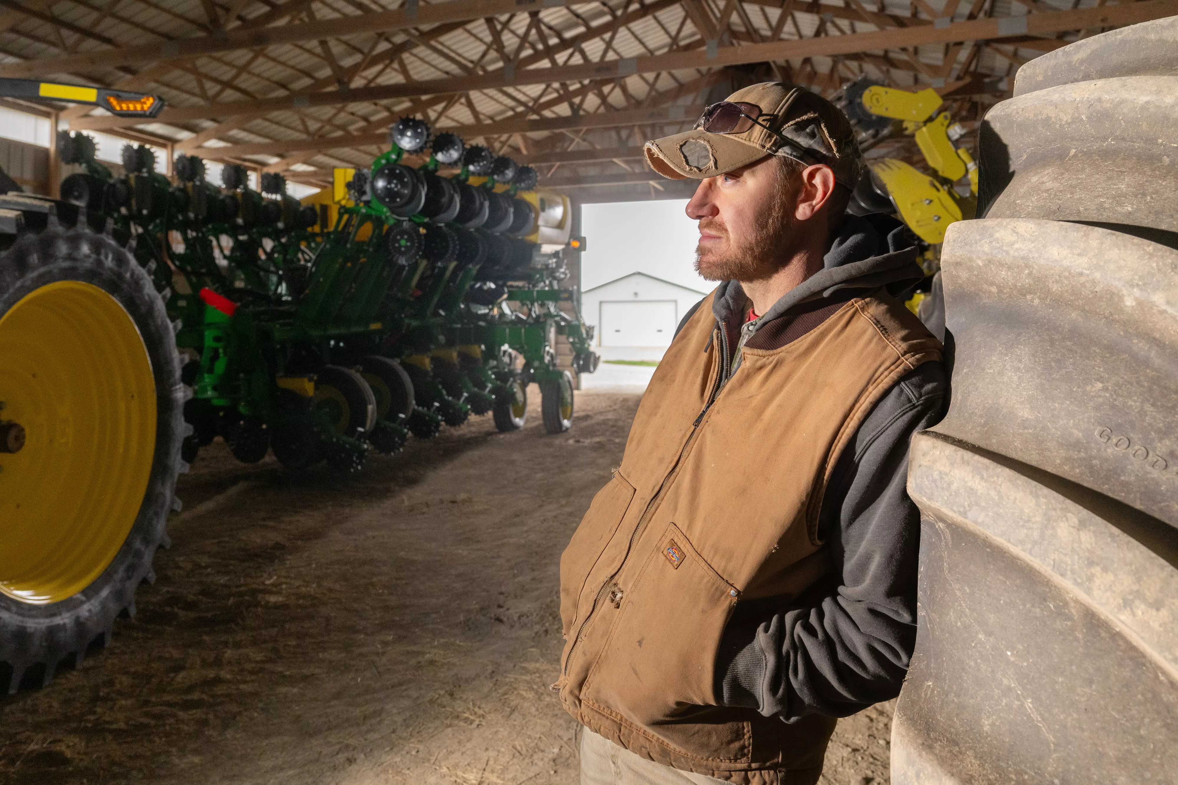 Jake Lieb with his John Deere equipment at his farm near Monticello, IL on Monday, March 18, 2024. photo by Darrell Hoemann/The Midwest Center for Investigative Reporting