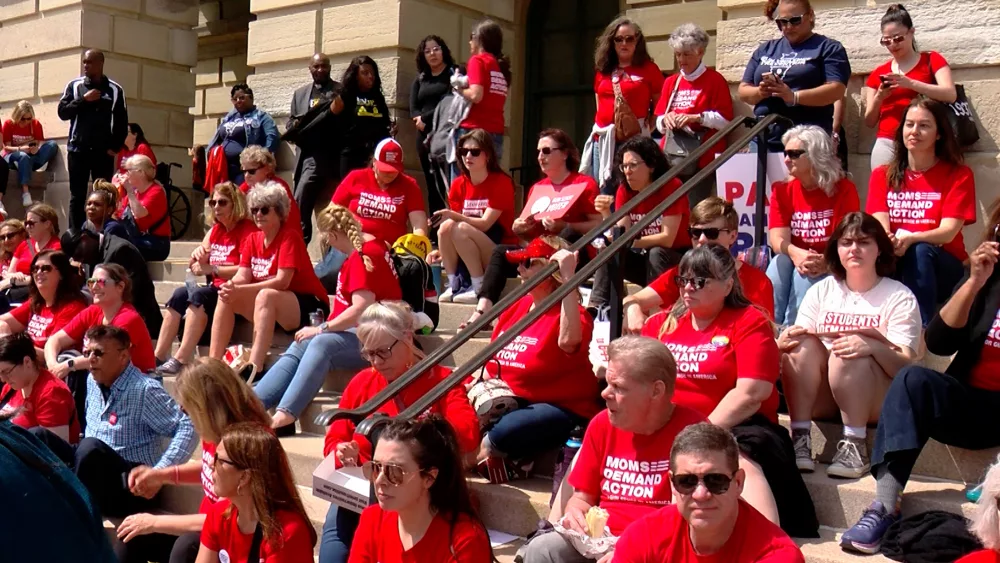 Advocates from the organization Moms Demand Action gather outside the Illinois State Capitol on Tuesday. They are urging lawmakers to pass legislation they believe will reduce gun violence. (Capitol News Illinois image by Andrew Campbell)