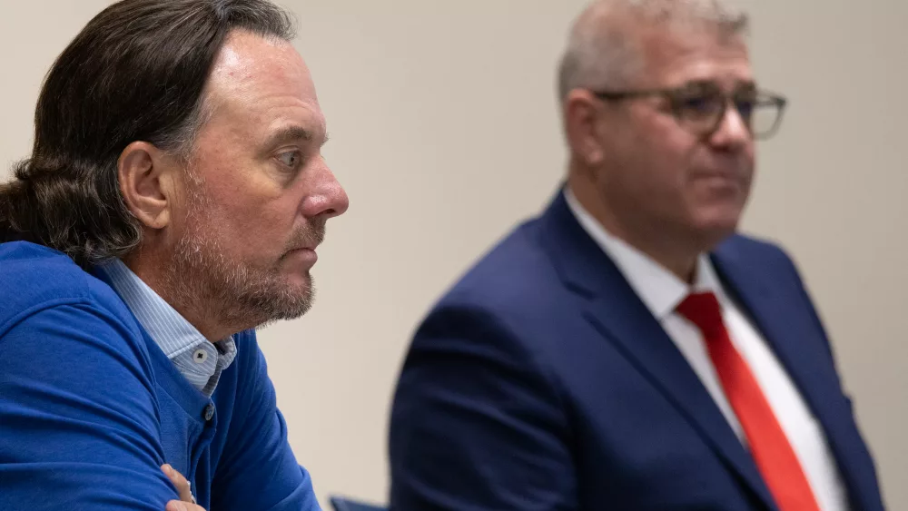 Darren Bailey (right) offers testimony during a hearing over allegations that he illegally coordinated campaign expenditures with GOP operative Dan Proft (left) during the 2022 gubernatorial campaign. (Capitol News Illinois photo by Andrew Adams)